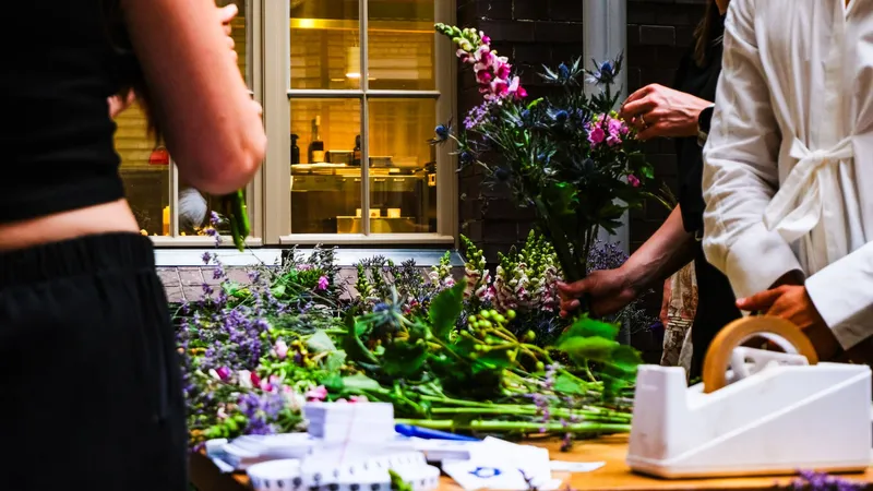 A flower bar table laid out with lavender, snapdragons and thistle as participants select stems for their bouquets